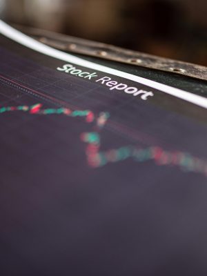Detailed stock report showing market trends on paper charts.